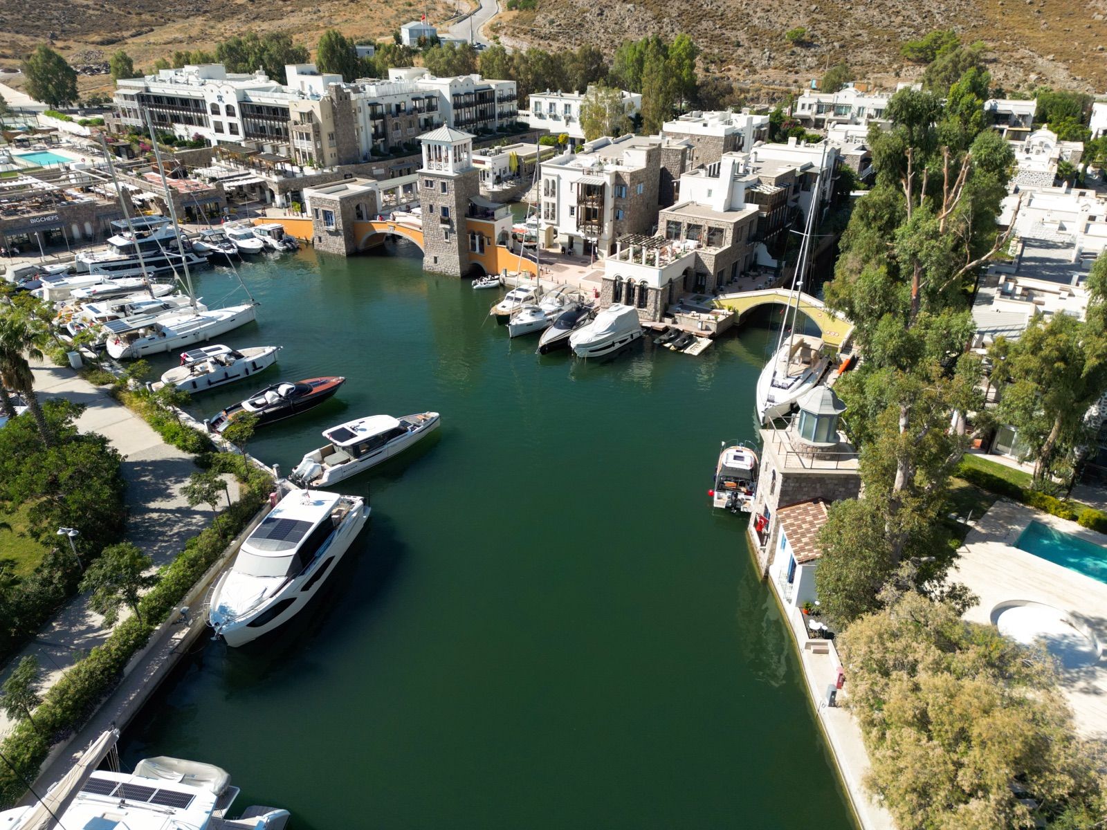 Aerial view of the marina channel and moored yachts