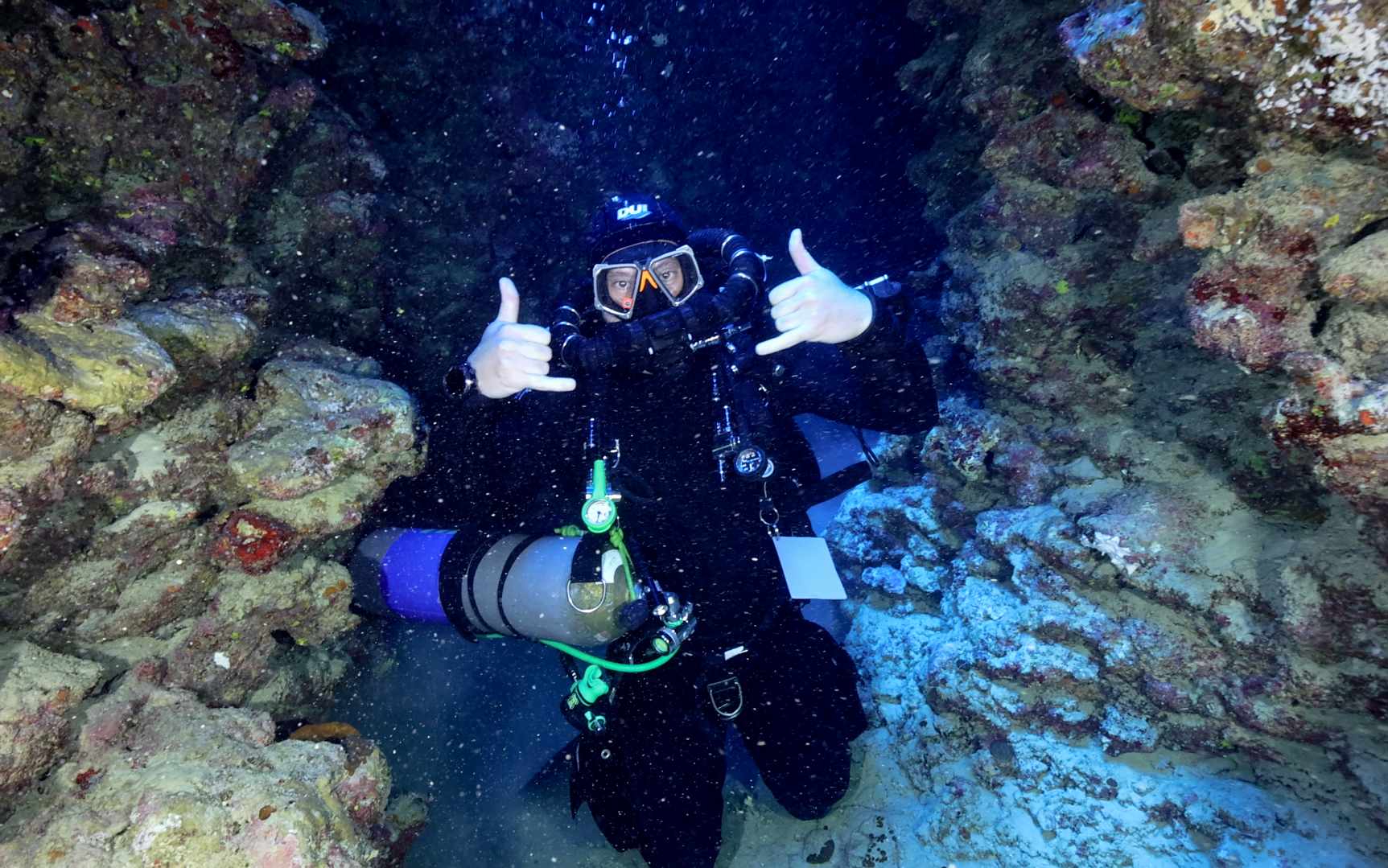 Divers preparing to enter the water from the DiveTalia RIB