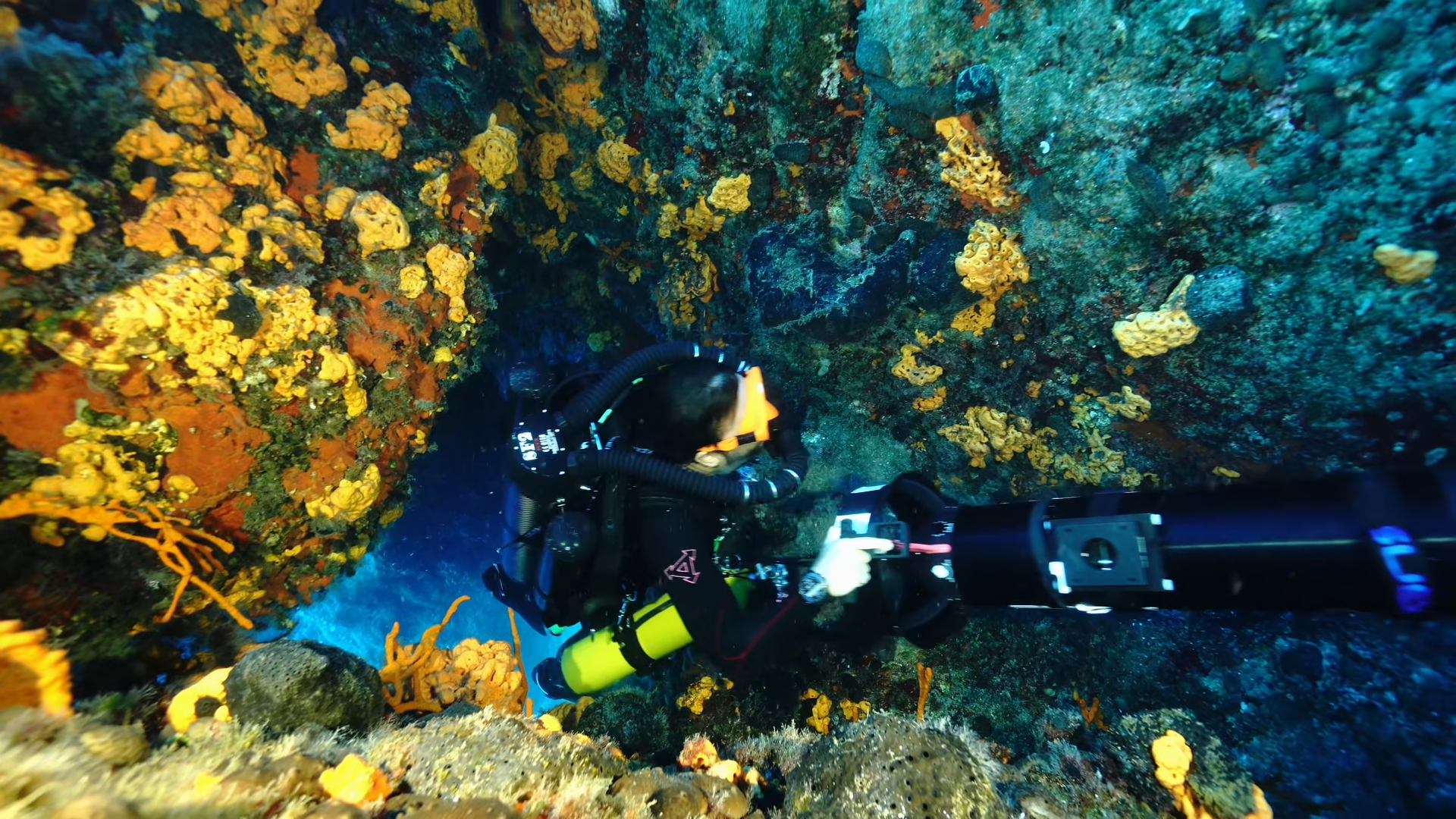Diver on a closed-circuit rebreather, breathing loop and counterlungs in view